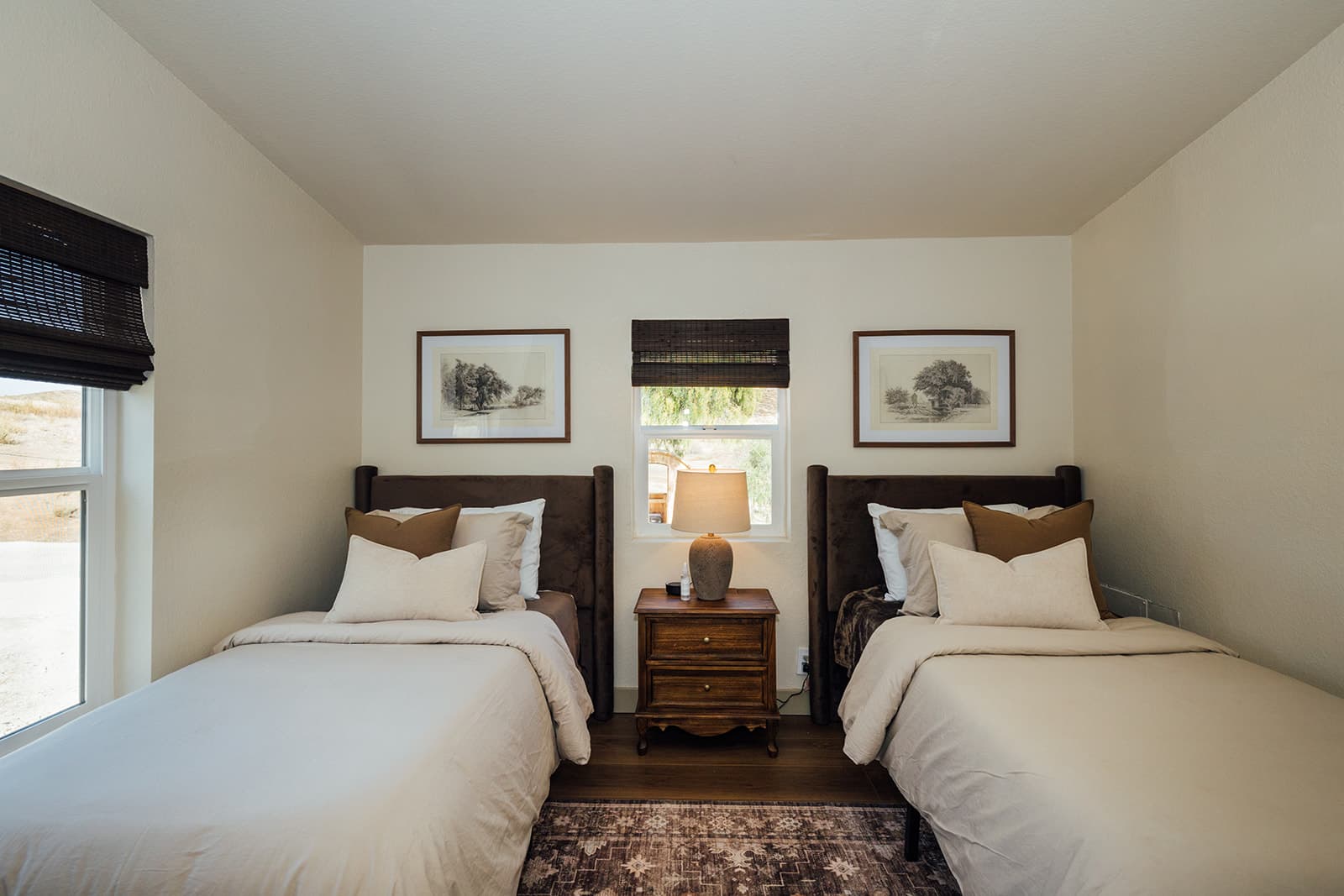 Twin bedroom with two single beds and pencil sketches