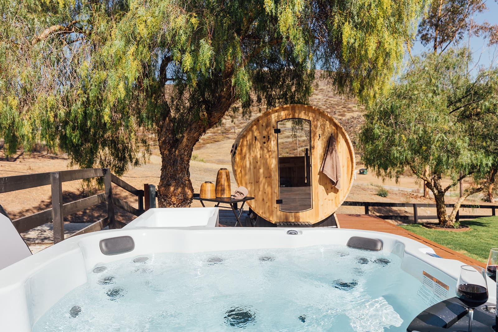 Jetted hot tub with a glass of wine