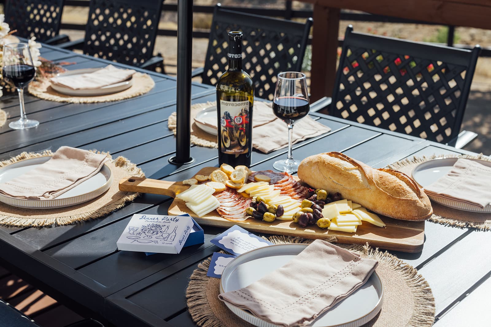 A welcome spread laid out on the outdoor dining table at The Harvest House
